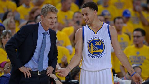 Curry chatting with Warriors coach Steve Kerr in the 2015 NBA Playoffs.
