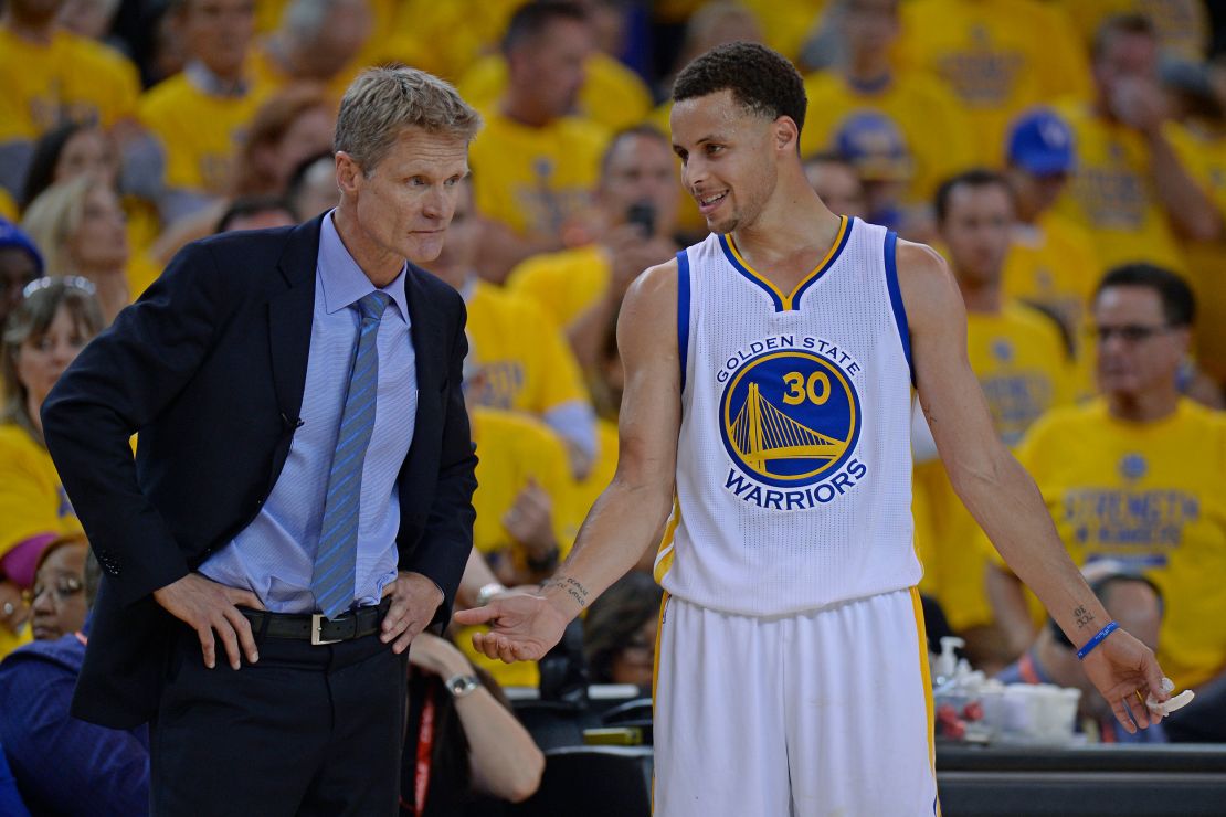 Curry chatting with Warriors coach Steve Kerr in the 2015 NBA Playoffs.