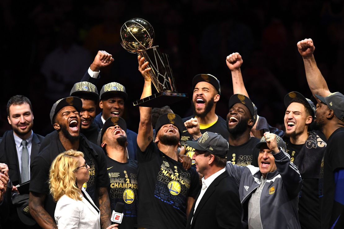 Curry celebrates with the Larry O'Brien Trophy after sweeping the Cleveland Cavaliers in the 2018 NBA Finals.