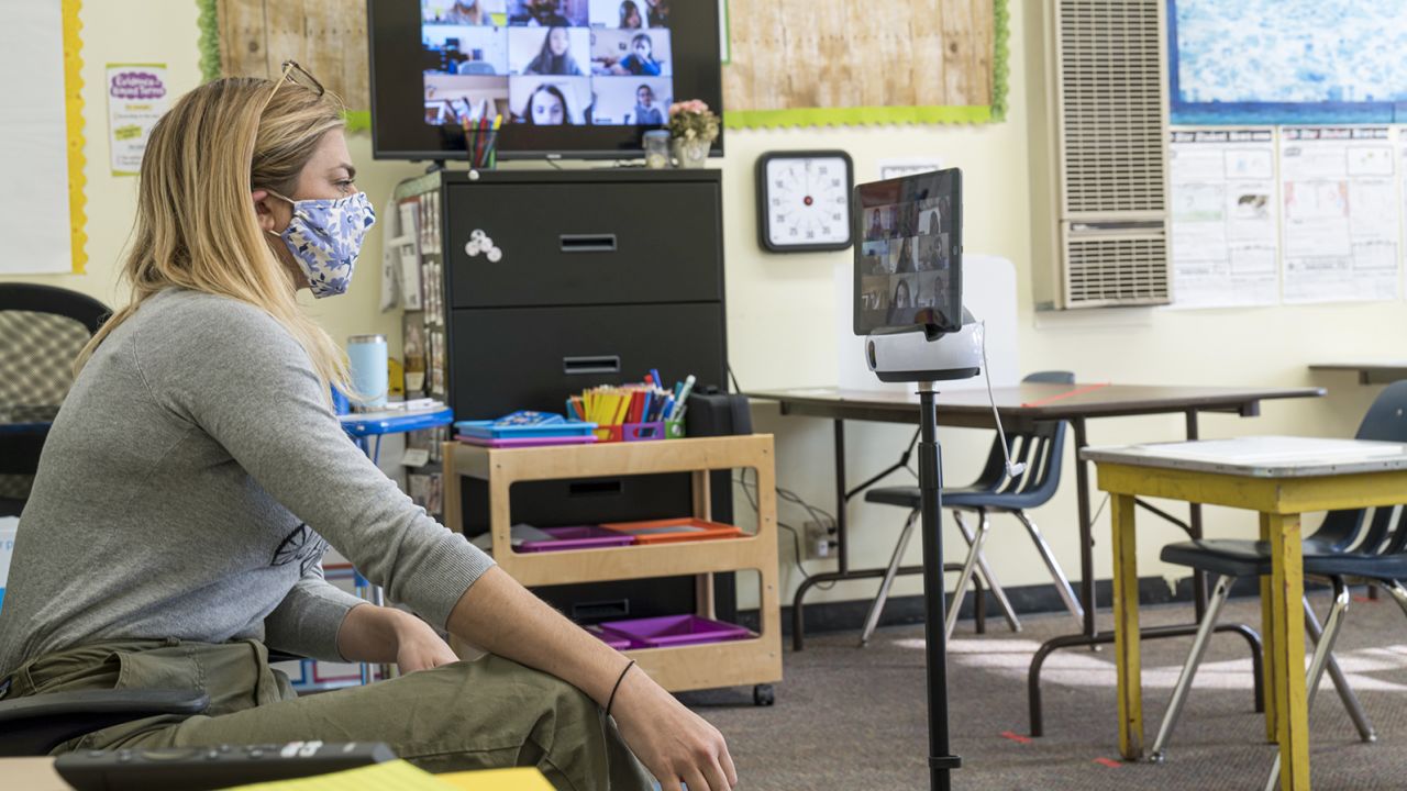 A teacher speaks to students learning remotely at an elementary school in San Francisco in October 2020.