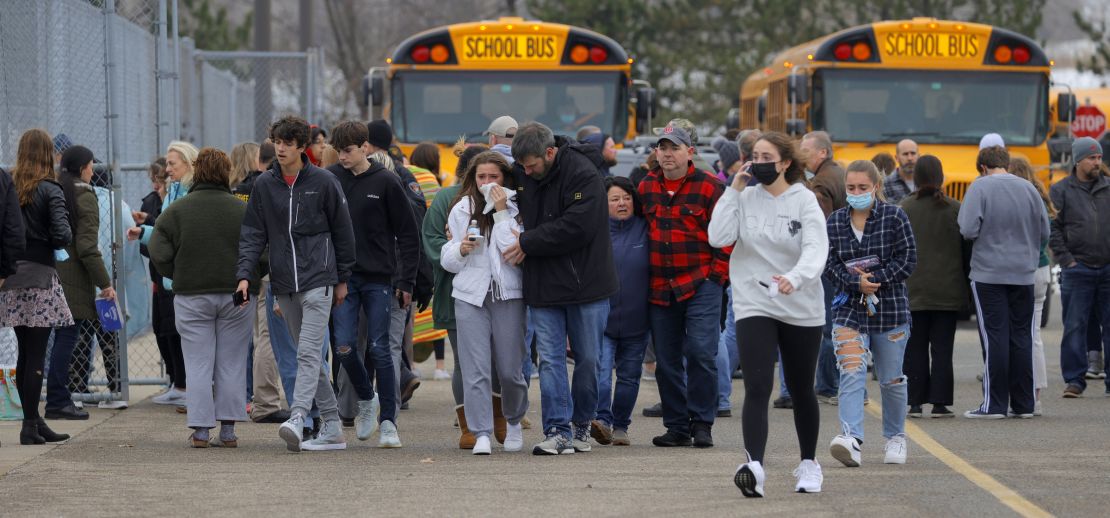 Parents retrieve their kids after the shooting at Oxford High School in Michigan on November 30.