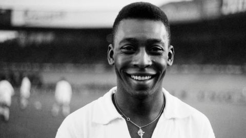 Brazilian striker Pelé, wearing his Santos jersey, smiles before playing a friendly soccer match with his club against the French club of "Racing", on June 13, 1961 in Colombes, in the suburbs of Paris. - Pelé score one goal as Santos won 5-4. Widely considered to be the greatest player in soccer history, Pelé scored 1282 goals in his career and won three World Cup titles with Brazil (1958 in Sweden, 1962 in Chile, 1970 in Mexico). (Photo by - / AFP) (Photo by -/AFP via Getty Images)