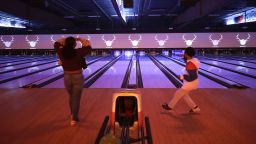 Bryce Henderson, 11 right, celebrates a missed roll after heckling his sister, Jaylin, 16, during a competitive game at Bowlero Los Angeles bowling alley in Westchester on Tuesday, April 6, 2021.