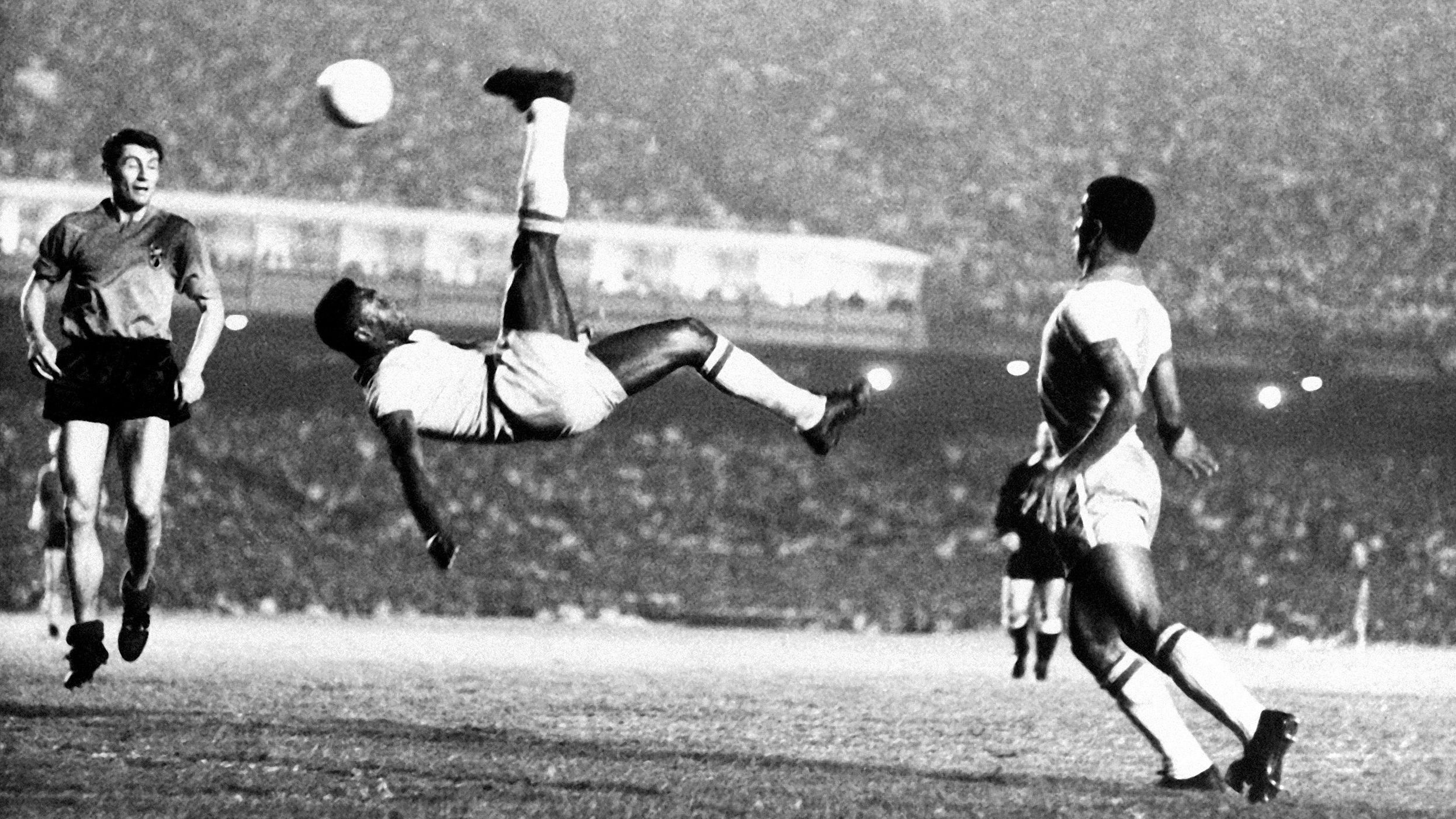 Pelé performs an overhead kick during a match in 1965. Dutch soccer star Johan Cruyff once said Pelé "was the only footballer who surpassed the boundaries of logic."