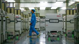 Automatic guided vehicles (AGV) move components on the production line of solar cell at a 5G intelligent workshop of Hengdian Group DMEGC Magnetics Co., Ltd on December 13, 2021 in Jinhua, Zhejiang Province of China.