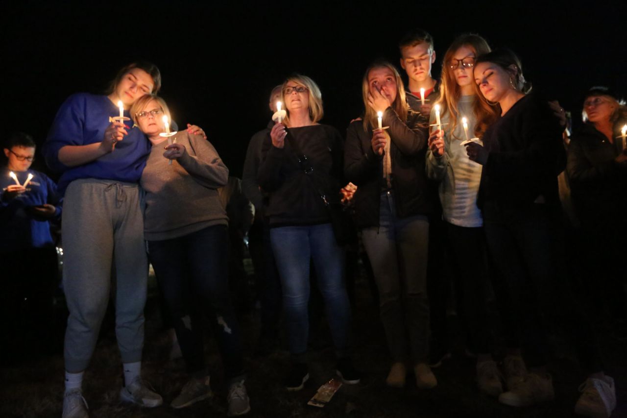 People gather at a vigil on Tuesday, December 14, in Mayfield, Kentucky, for those who were killed when the roof collapsed at a candle factory.