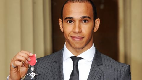 Hamilton with his MBE at Buckingham Palace, 2009.