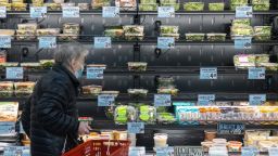 A customer shops in the prepared food section of the Trader Joe's Upper East Side Bridgemarket grocery store in New York, U.S., on Thursday, Dec. 2, 2021. 