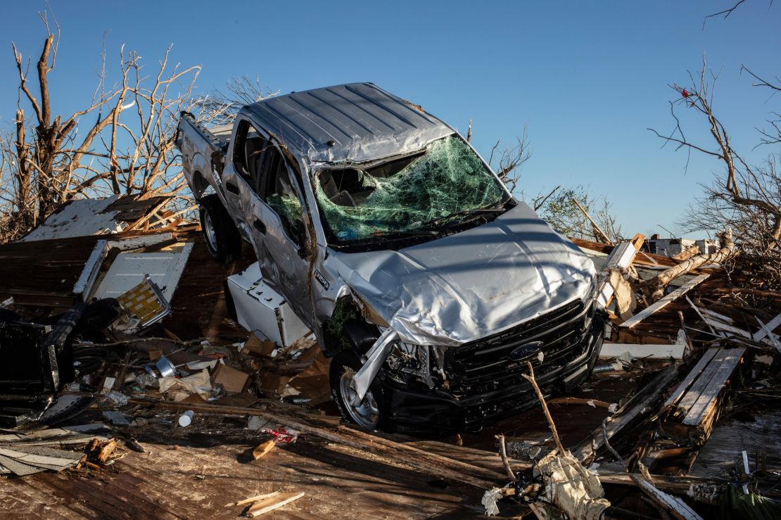 A truck was thrown onto the remains of a home during the tornado outbreak.