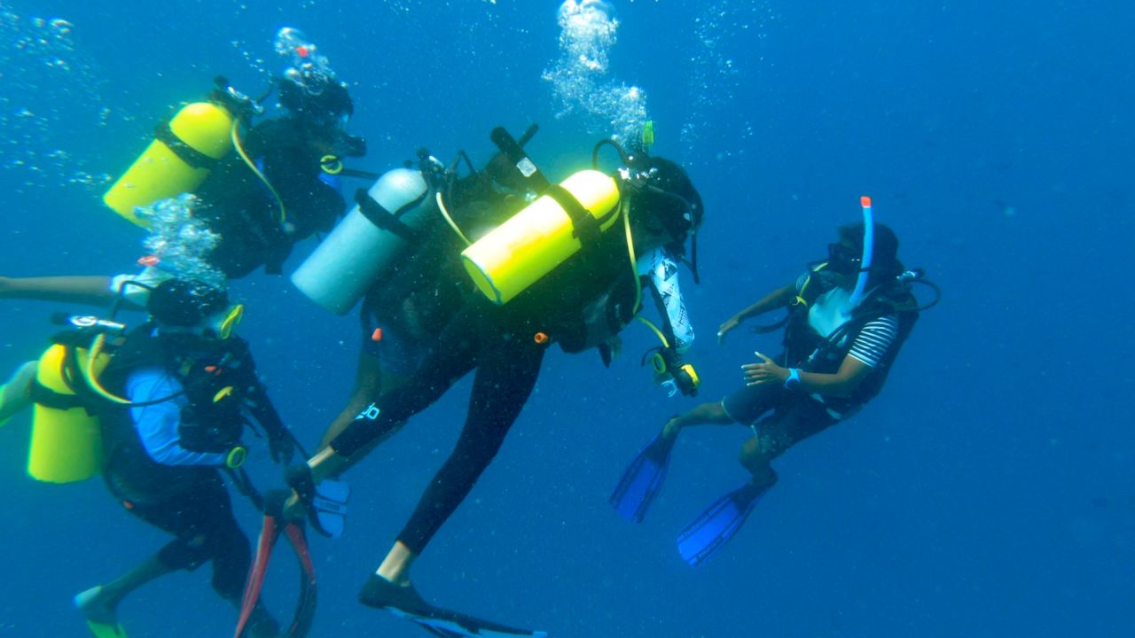 Naseem teaches up to two dozen students to scuba dive at any given time.