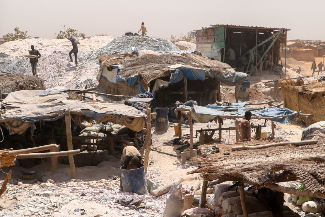 In this file photo taken in February 2020, miners work at a gold mine in Bouda, Burkina Faso. A growing number of small-scale gold miners are out of work in Burkina Faso as jihadists try to seize control of the country's most lucrative industry.