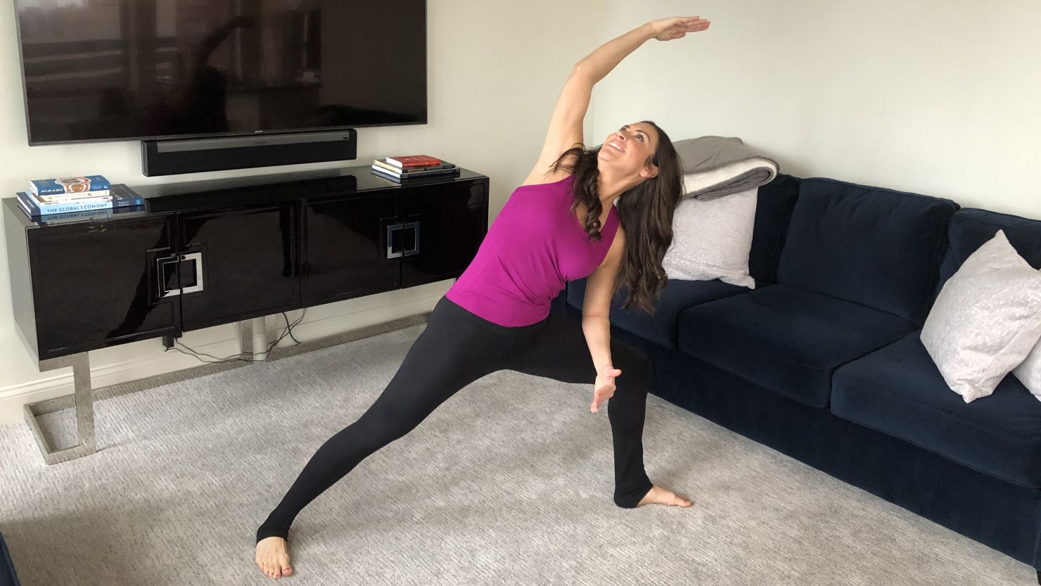 Stephanie Mansour, host of "Step It Up With Steph" on PBS, demonstrates the side-angle pose, which can help loosen up muscles in the upper back, neck and shoulders.