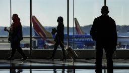 Travelers walk through the concourse at BaltimoreWashington Airport (BWI) in Baltimore, Maryland, U.S., on Wednesday, Nov. 24, 2021. 