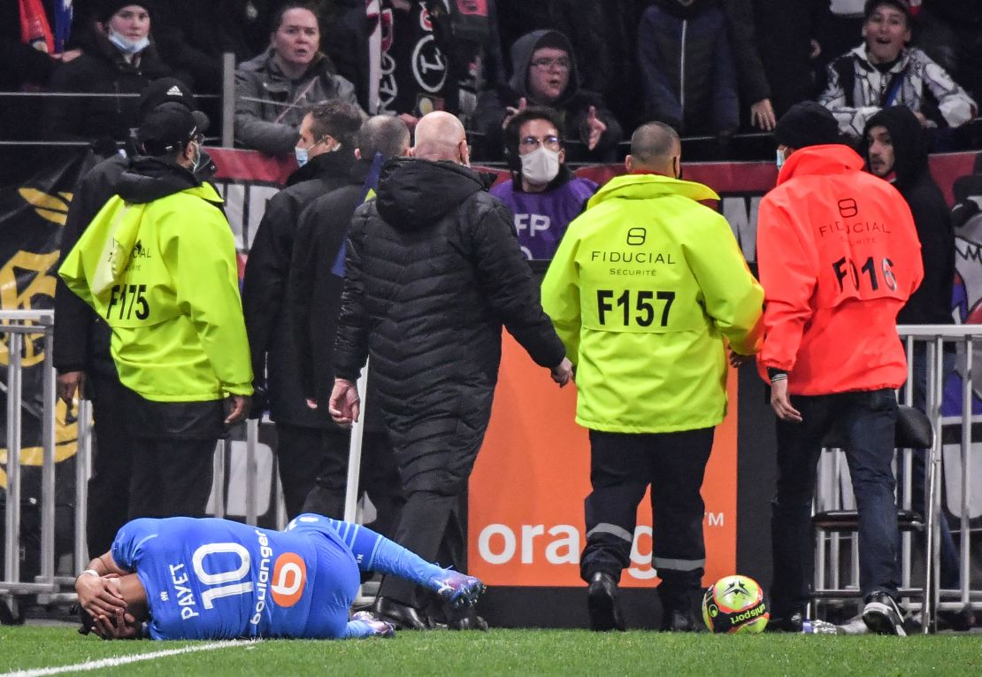 Marseille's Dimitri Payet is hit by a water bottle thrown from the crowd during a match against Lyon in November.