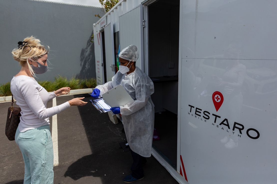 A resident registers her details at a Covid-19 mobile testing site in the Milnerton district of Cape Town, South Africa, on December 2.