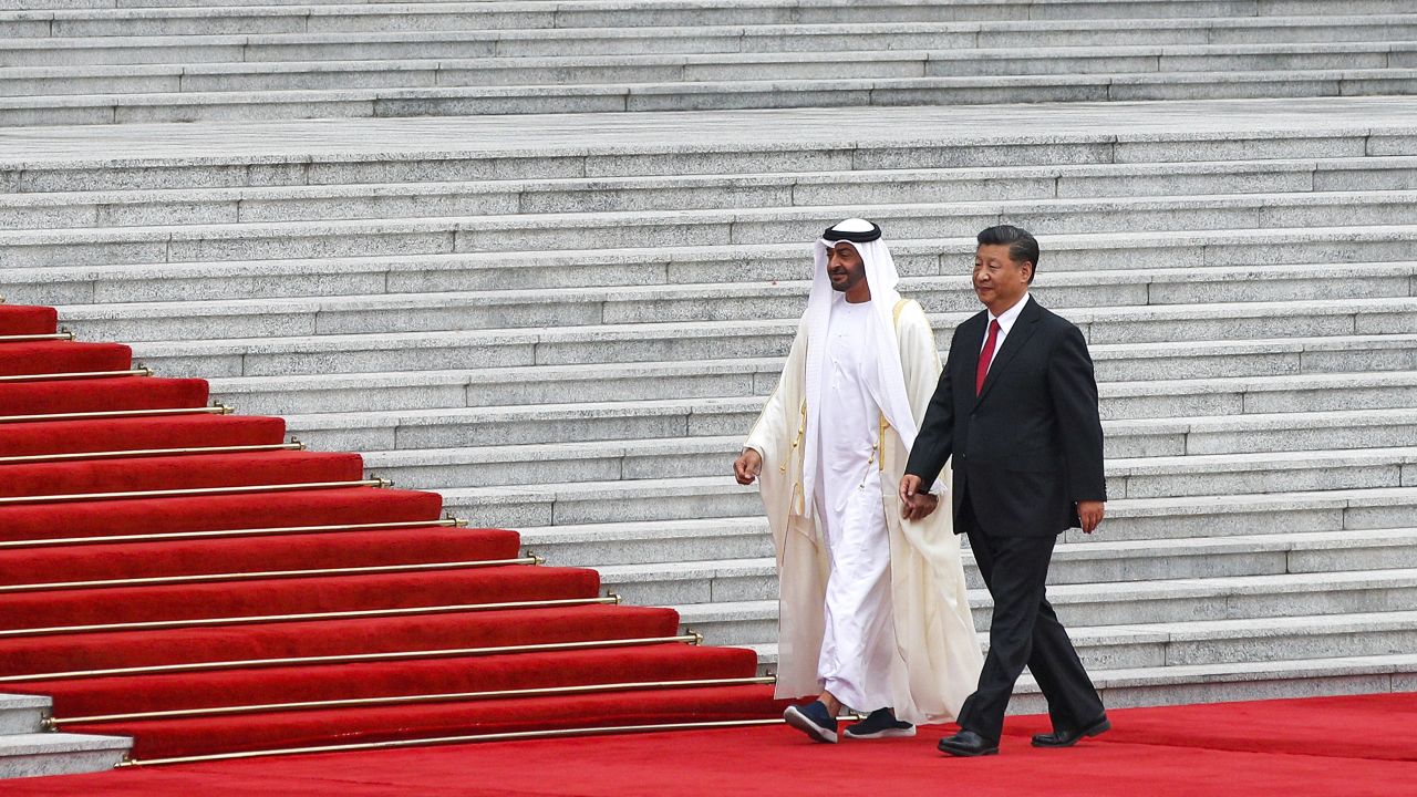 Abu Dhabi's Crown Prince, Sheikh Mohammed bin Zayed Al Nahyan, second from right, walks with Chinese President Xi Jinping as they arrive for a welcome ceremony at the Great Hall of the People in Beijing, Monday, July 22, 2019.
