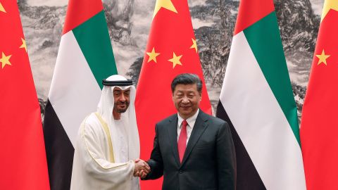 Abu Dhabi's Crown Prince Mohammed bin Zayed shakes hands with Chinese President Xi Jinping after witnessed a signing ceremony at the Great Hall of the People in Beijing on July 22, 2019. 
