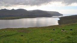 The bed of this lake on the island of Eysturoy contains a sediment layer laid down around 500 AD that documents the first arrival of sheep, and thus humans, on the archipelago.