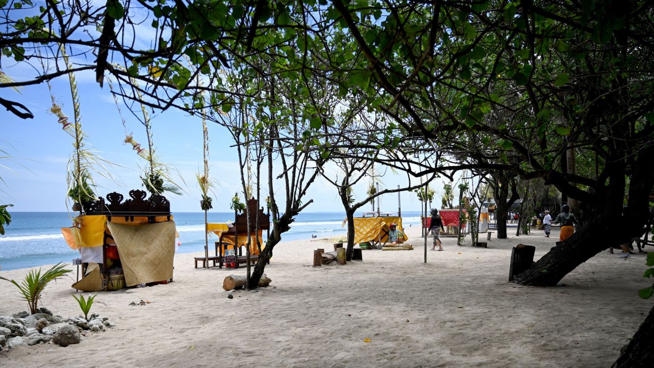 A general view shows a near-empty beach in Kuta on Indonesia's resort island of Bali on March 22, 2020, amid concerns of the COVID-19 coronavirus outbreak. (Photo by SONNY TUMBELAKA / AFP) (Photo by SONNY TUMBELAKA/AFP via Getty Images)