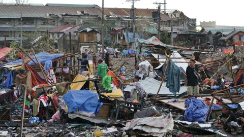 Residents salvage what's left of the their damaged homes caused by Typhoon Rai in Cebu city on Friday, December 17, 2021. 
