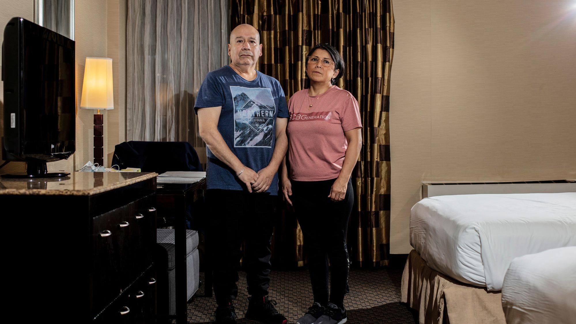 Mario Gamino, left, and Bibiane L. Chamorro are among the people displaced by Hurricane Ida who are now staying at the Radisson Hotel by the JFK Airport in Queens.