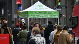Photo by: NDZ/STAR MAX/IPx 2021 12/16/21 People wait in line to receive a COVID-19 test at a mobile COVID-19 testing site in the Financial District of Manhattan on December 8, 2021 in New York.