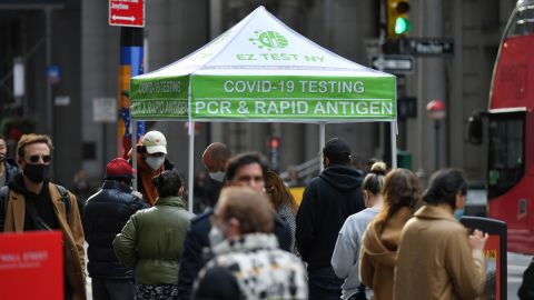 People wait in line to receive a Covid-19 test at a mobile testing site in Manhattan on December 8, 2021.