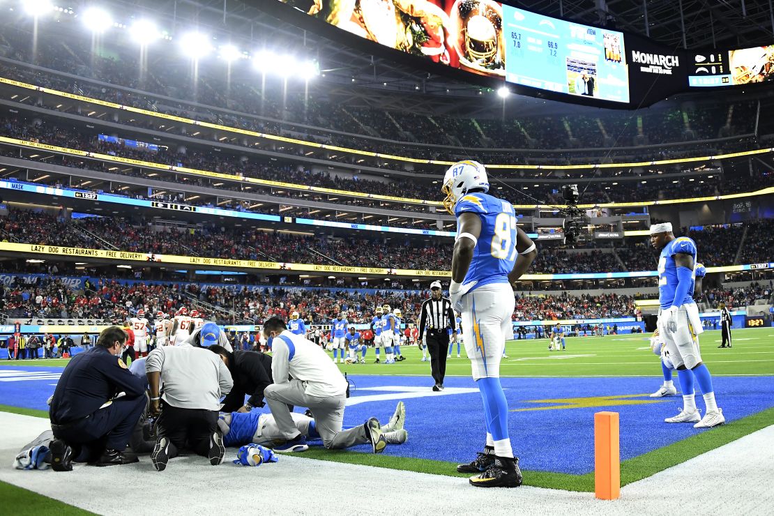 Jared Cook watches as Parham Jr. is assessed for injury in the first quarter of the game against the Chiefs at SoFi Stadium.