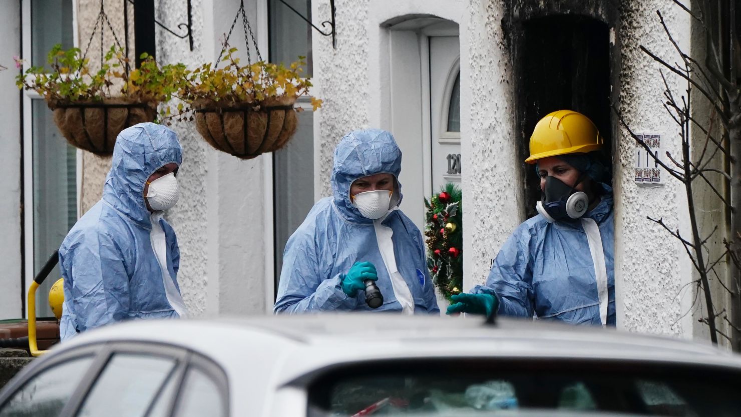 Forensic investigators at the scene in Collingwood Road, Sutton, south London, where two sets of twin boys died in a devastating house fire on Thursday.