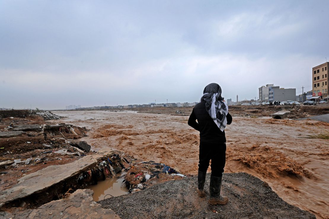 An Erbil resident takes a video of river water levels on the outskirts of the city.