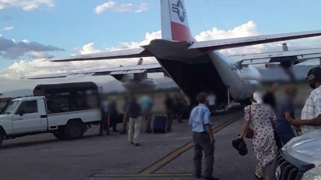 CNN-obtained images show the released hostages boarding the coast guard plane on Thursday.