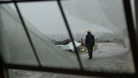 An Amish man walks to unload donations brought by community members in Mayfield, Kentucky.