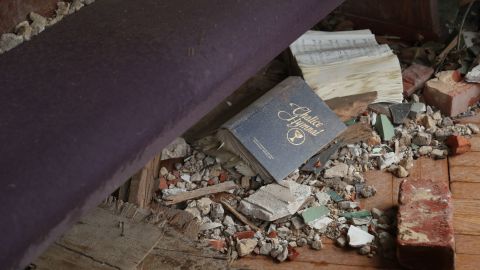 A hymnal lies among the debris in Mayfield.