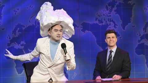 Bowen Yang as the Iceberg that sank the Titanic, left, and anchor Colin Jost during Weekend Update on "Saturday Night Live" in New York on April 10, 2021. 