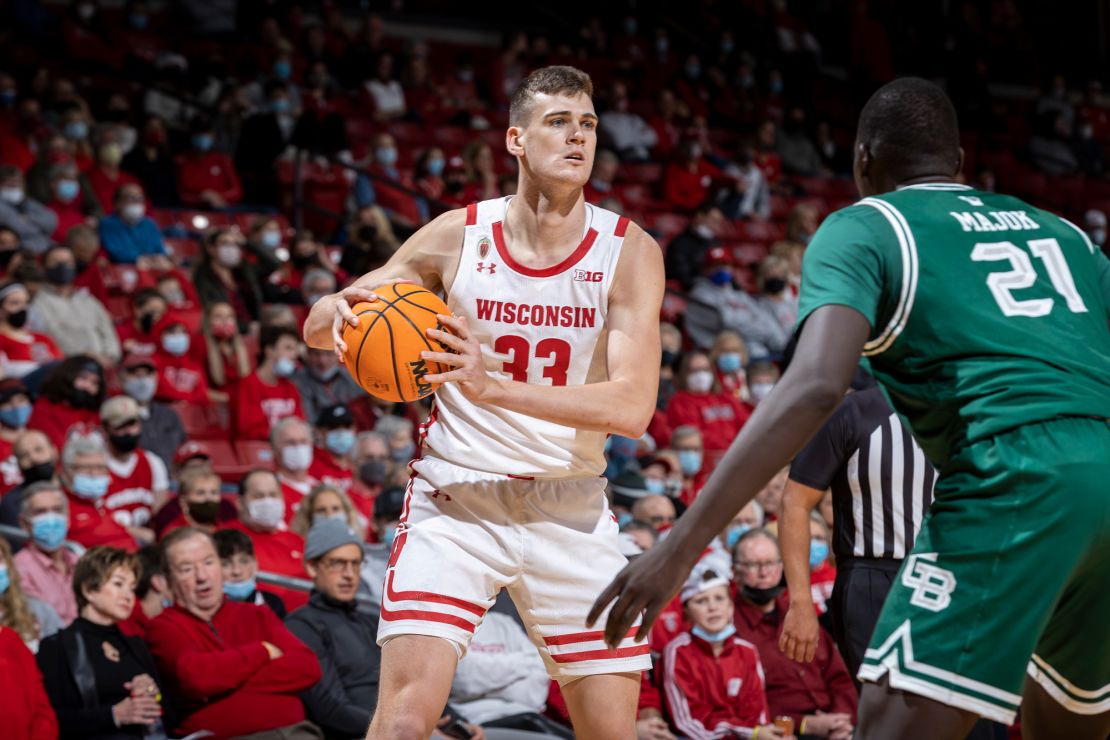 Wisconsin Badgers center Chris Vogt handles the ball during an NCAA college men's basketball game against the University of Green Bay Phoenix.