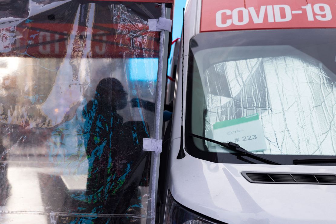 A person gets tested for Covid-19 at a mobile testing site in Times Square on Friday, December 17, in New York.
