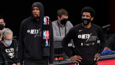 Kevin Durant #7 and Kyrie Irving #11 of the Brooklyn Nets look on during the first half of Game Five of their Eastern Conference first-round playoff series against the Boston Celtics at Barclays Center on June 01, 2021 in the Brooklyn borough of New York City.