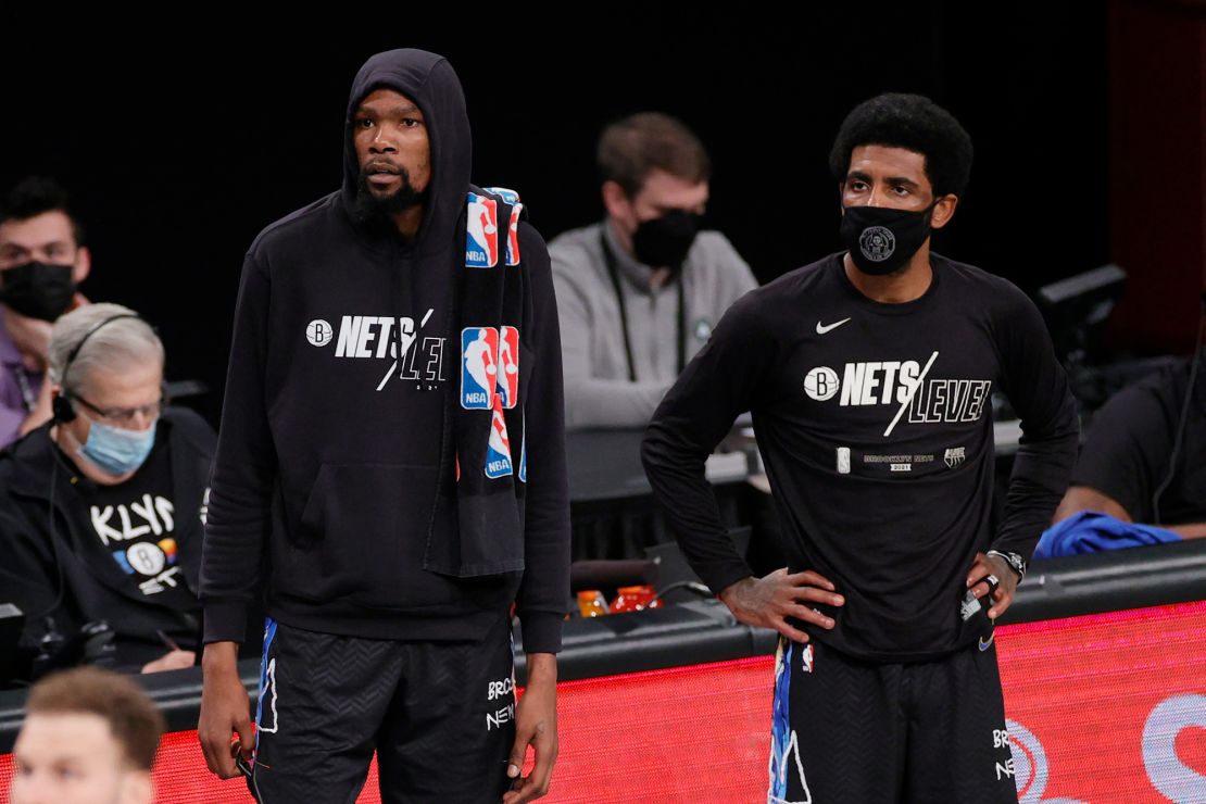 Kevin Durant #7 and Kyrie Irving #11 of the Brooklyn Nets look on during the first half of Game Five of their Eastern Conference first-round playoff series against the Boston Celtics at Barclays Center on June 01, 2021 in the Brooklyn borough of New York City.