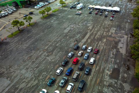 Drivers wait in line to be tested at the Hiram Bithorn Stadium parking lot in San Juan, Puerto Rico, on December 18.