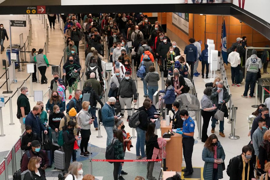 Travelers wait in a line December 10 for a security check at Seattle-Tacoma International Airport.