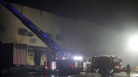 Firefighters work on cleanup after a fire ripped through a distribution center for the QVC home shopping television network in Rocky Mount, North Carolina.