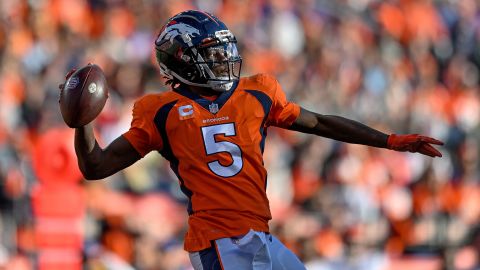 Denver Broncos quarterback Teddy Bridgewater passes under pressure during a game between the Denver Broncos and the Cincinnati Bengals at Empower Field at Mile High on Sunday in Denver.