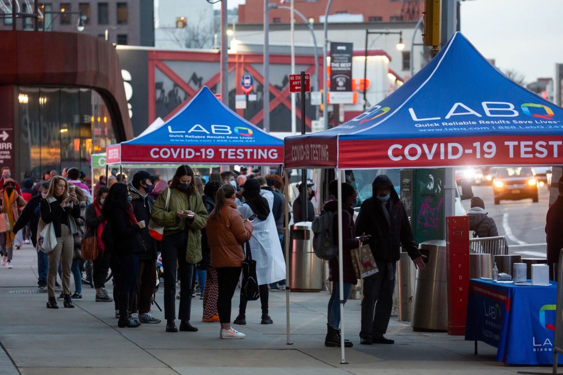 People wait in line for Covid-19 tests in Brooklyn, New York, on December 17, 2021.