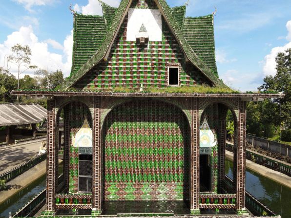 This <a href="index.php?page=&url=https%3A%2F%2Fwww.architecturaldigest.com%2Fstory%2Fthis-thai-temple-built-using-millions-beer-bottles" target="_blank" target="_blank">temple</a> in Sisaket, Thailand, was conceived by a group of Buddhist monks in 1984. It is estimated that over one million glass bottles were used for the build, adorning the entrance, roof and walls of the concrete structure. Inside, intricate patterns and mosaics made from bottle caps cover the walls. 
