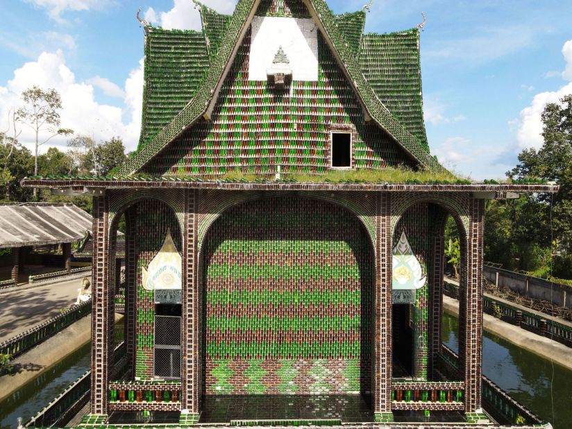This <a href="https://www.architecturaldigest.com/story/this-thai-temple-built-using-millions-beer-bottles" target="_blank" target="_blank">temple</a> in Sisaket, Thailand, was conceived by a group of Buddhist monks in 1984. It is estimated that over one million glass bottles were used for the build, adorning the entrance, roof and walls of the concrete structure. Inside, intricate patterns and mosaics made from bottle caps cover the walls. 