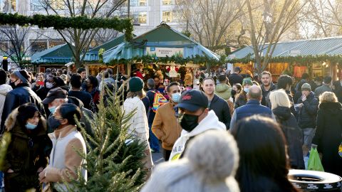 Shoppers walk through the Urbanspace Union Square Holiday Market in New York City, on Dec. 12, 2021. 