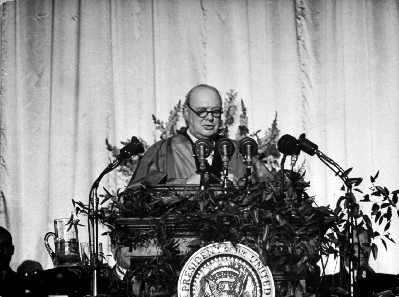British Prime Minister Winston Churchill delivers a speech at Westminster College in Fulton, Missouri, on March 5, 1946. "From Stettin in the Baltic to Trieste in the Adriatic, an Iron Curtain has descended across the Continent," he declared.