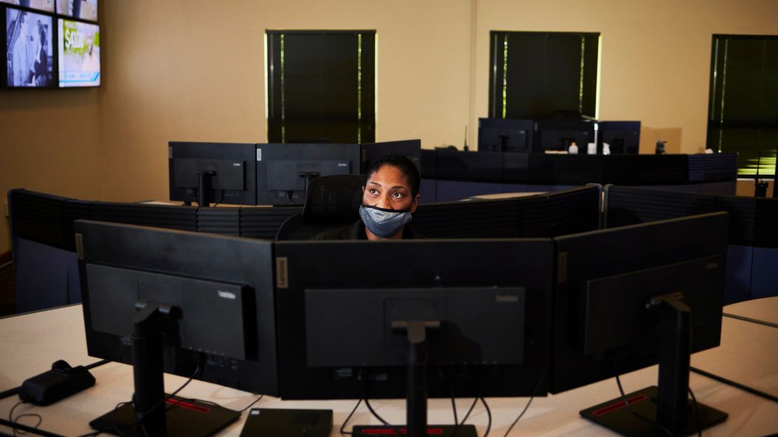 Tracy Muhammad monitors screens in the Jackson Police Department's command center.