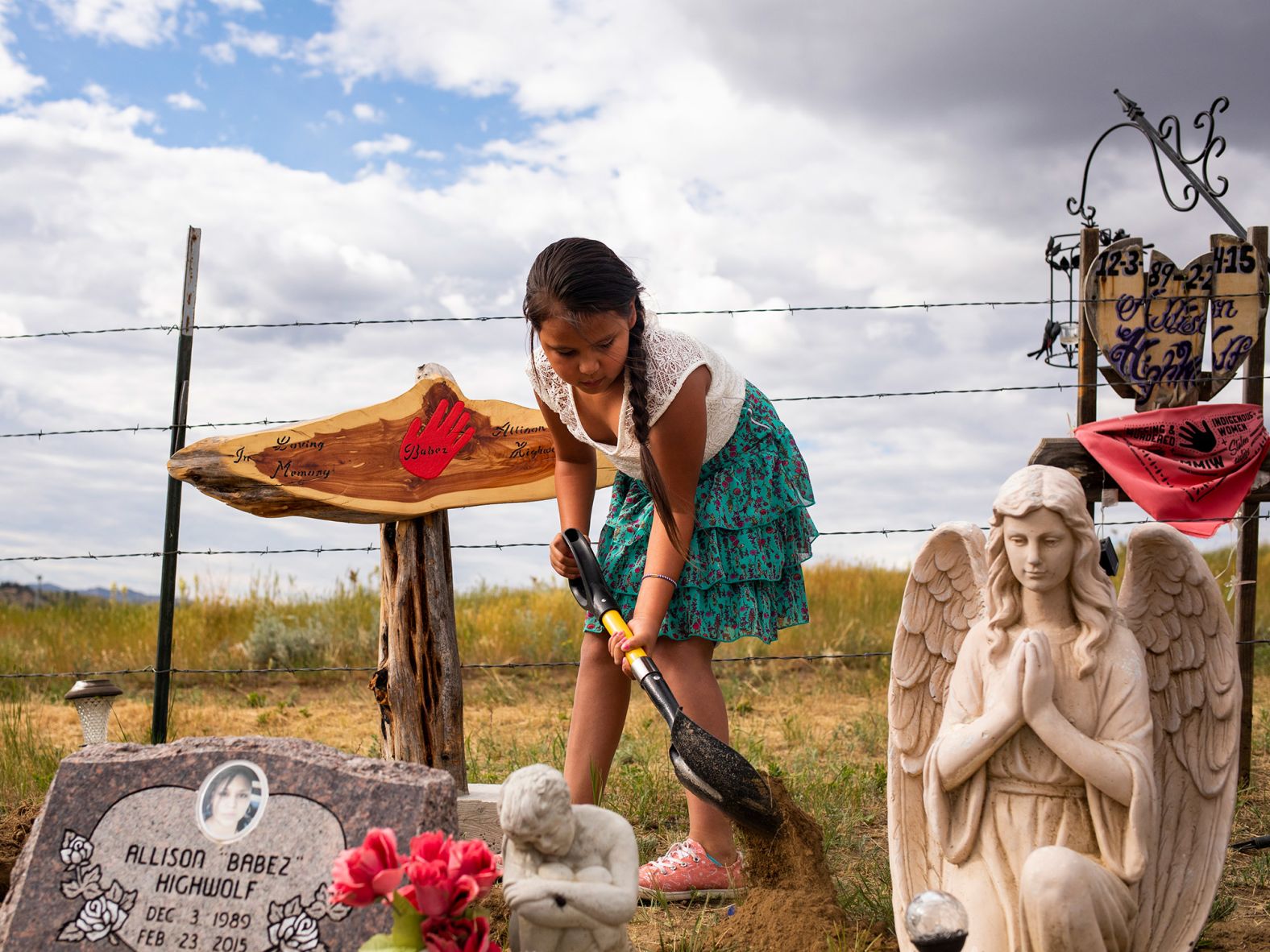 <strong>Tailyr Irvine, based in Missoula, Montana, USA: </strong>Aiyanna, one of four daughters, tends to her mother Allison Highwolf's grave in Busby, Montana, a town on the Northern Cheyenne Reservation. As Elizabeth Williamson <a href="index.php?page=&url=https%3A%2F%2Fwww.nytimes.com%2F2021%2F07%2F11%2Fus%2Fpolitics%2Fallison-highwolf-indian-country.html" target="_blank" target="_blank">reported for The New York Times:</a> Allison Highwolf's body was 'found alone in a motel room in February 2015. She died at 26 years old of smoke inhalation from a fire of unclear origin ... Six years later, the circumstances of Highwolf's death remains a mystery, one of many involving Native women who disappear or meet violent ends with alarming regularity.'<br /> <br />I met with the family and spent the day hearing about Allison and the case. That afternoon they planned to visit her grave to place a grave marker. I asked if I could attend and they graciously let me observe and photograph. I tried my best to keep a distance during their time at the grave to respect their privacy.<br /> <br />It's hard to visualize grief and loss but every time I look at this photo I am hit with the loss I feel for Aiyanna and her family. We hear a lot about the <a href="index.php?page=&url=https%3A%2F%2Fwww.nativehope.org%2Fen-us%2Funderstanding-the-issue-of-missing-and-murdered-indigenous-women" target="_blank" target="_blank">Missing and Murdered Indigenous Women</a> crisis but we rarely see the aftermath, the path of destruction unsolved cases leave.