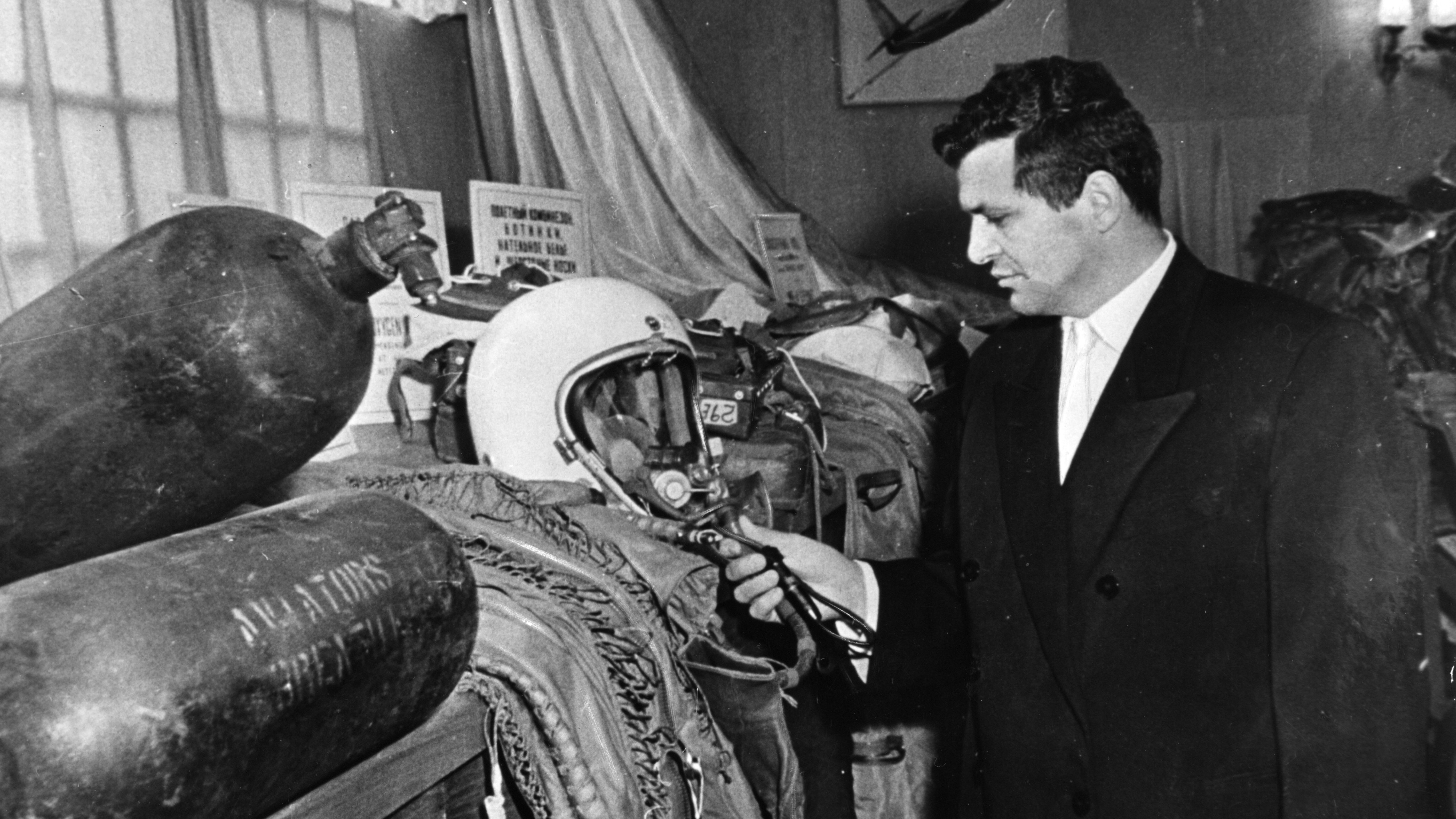 U-2 spy plane pilot Francis Gary Powers poses with his flight helmet among other evidence related to his Moscow trial in 1960. After the Soviets announced the capture of Powers, the United States recanted earlier assertions that the plane was on a weather research mission.